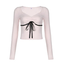 aesthetic clothes brands pink long sleeve crop top with black bow