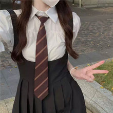 womens dark academia fashion outfit inspiration aesthetic school uniform pleated skirt tie