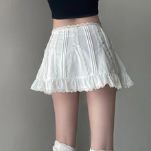 pleated white mini skirt