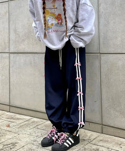 blokette coquette aesthetic clothes joggers with pink bows adidas samba