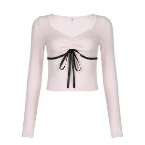 aesthetic clothes brands pink long sleeve crop top with black bow